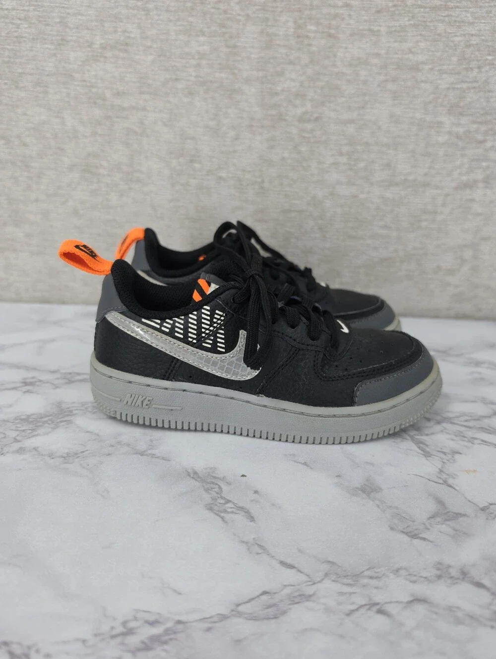 Nike Air Force Lv8 Kids Black & Gray Low-Top Sneakers with Orange Accent